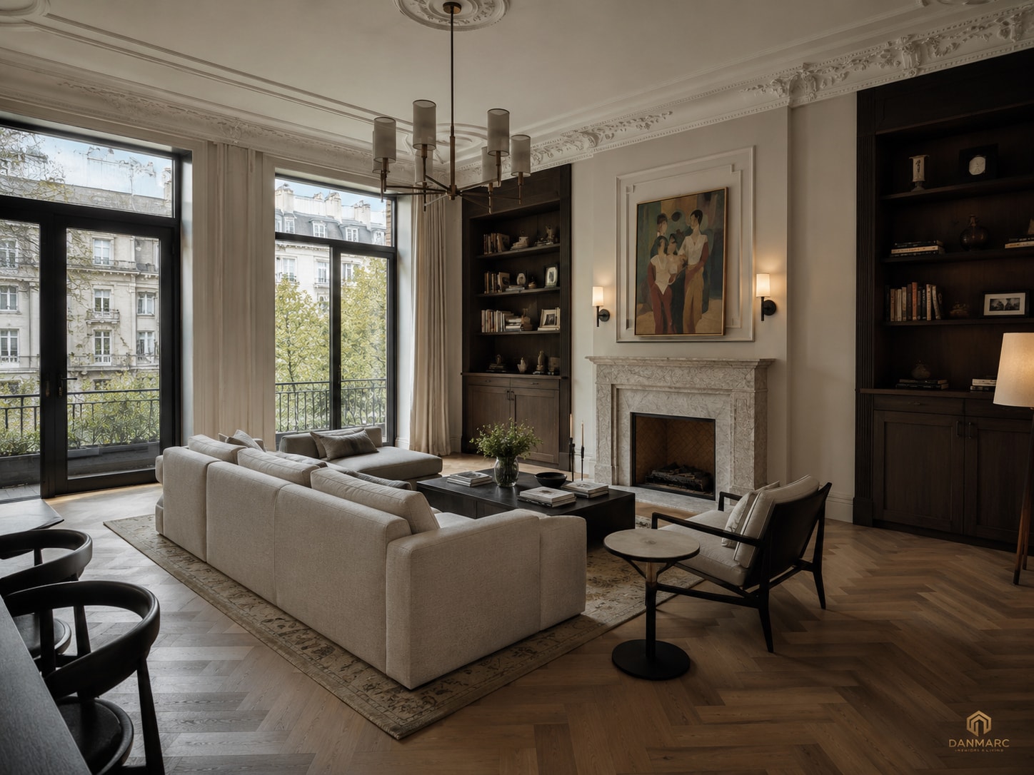 Living room with a pale L-shaped sofa, a stone fireplace under a framed painting, dark built-in bookcases and tall French windows onto balconies